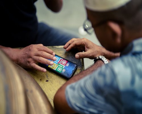 Smartphone displaying a colourful fictional adventure game interface