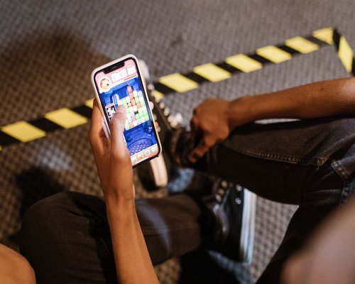 Smartphone displaying a fictional beginner tutorial game interface